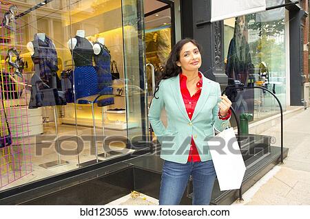Mixed race woman at storefront View Large Photo Image Stock Photography - Mixed race woman at storefront. Fotosearch