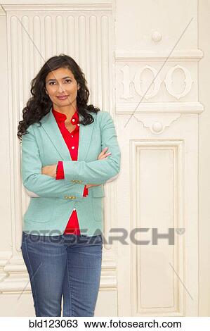 Mixed race woman smiling outside building View Large Photo Image Stock Image - Mixed race woman smiling outside building. Fotosearch