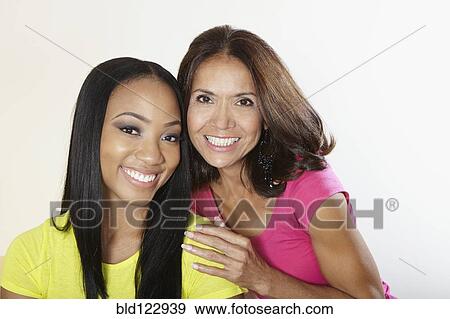 Mother and daughter smiling together View Large Photo Image Stock Photo - Mother and daughter smiling together. Fotosearch
