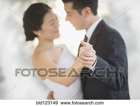 Newlywed couple dancing at wedding reception View Large Photo Image Stock Photo - Newlywed couple dancing at wedding reception. Fotosearch