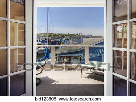 Patio overlooking boats in dock View Large Photo Image Stock Photo - Patio overlooking boats in dock. Fotosearch