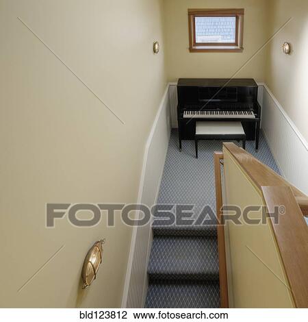 Piano on staircase in house View Large Photo Image Stock Image - Piano on staircase in house. Fotosearch