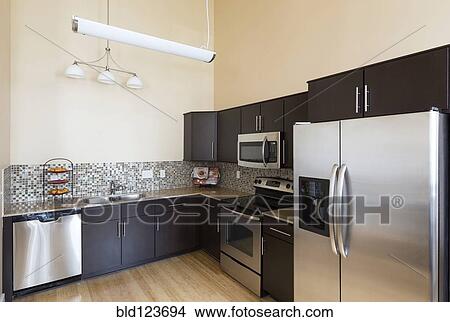 Picture - Refrigerator and counter tops in modern kitchen. Fotosearch