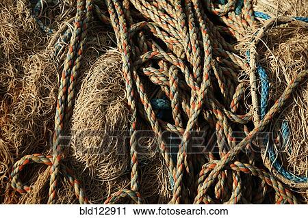 Ropes stacked on hay View Large Photo Image Stock Image - Ropes stacked on hay. Fotosearch