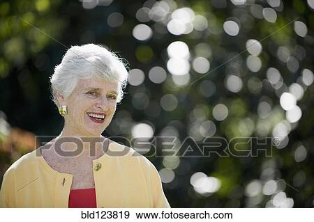 Stock Photo - Senior Caucasian woman smiling outdoors. Fotosearch