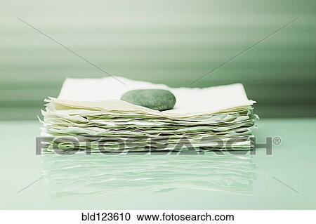 Stone on papers View Large Photo Image Stock Image - Stone on papers. Fotosearch