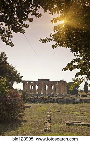 Sun rising over ancient ruins, Paestum, Campania, Italy View Large Photo Image Stock Photography - Sun rising over ancient ruins, Paestum, Campania, Italy. Fotosearch