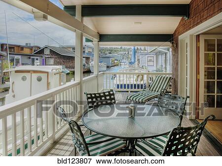 Table and chairs on patio View Large Photo Image Stock Photo - Table and chairs on patio. Fotosearch