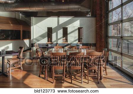 Tables and chairs in empty restaurant View Large Photo Image Stock Image - Tables and chairs in empty restaurant. Fotosearch