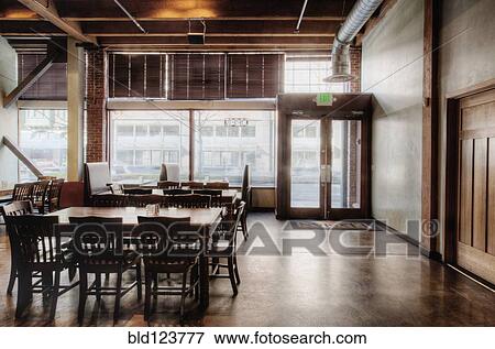 Tables and chairs in empty restaurant View Large Photo Image Stock Photo - Tables and chairs in empty restaurant. Fotosearch