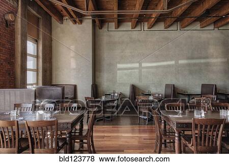 Tables and chairs in empty restaurant View Large Photo Image Stock Photo - Tables and chairs in empty restaurant. Fotosearch