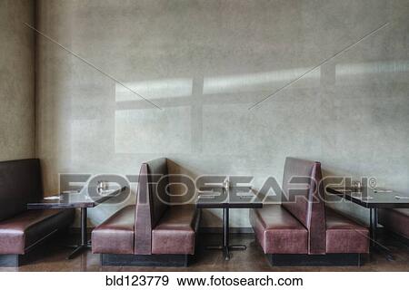 Tables and chairs in empty restaurant View Large Photo Image Stock Photo - Tables and chairs in empty restaurant. Fotosearch