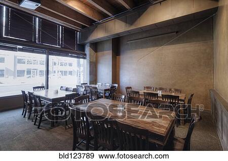 Tables and chairs in empty restaurant View Large Photo Image Stock Photo - Tables and chairs in empty restaurant. Fotosearch