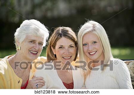 Stock Photo - Three generations of Caucasian women smiling outdoors. Fotosearch