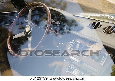 Vintage Ferrari dashboard viewed through window View Large Photo Image Stock Photo - Vintage Ferrari dashboard viewed through window. Fotosearch
