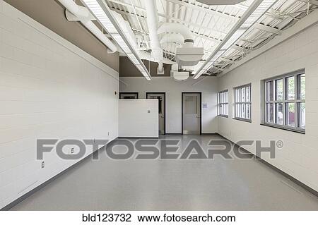 Stock Image - Windows along empty room in animal shelter. Fotosearch