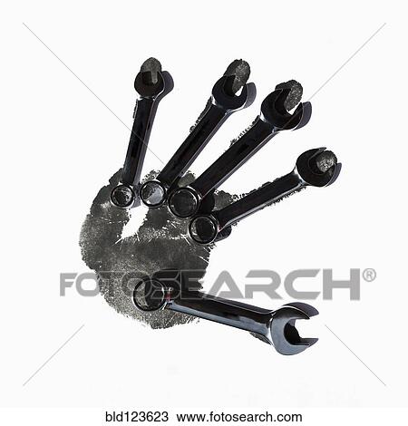 Wrenches over black handprint View Large Photo Image Stock Image - Wrenches over black handprint. Fotosearch