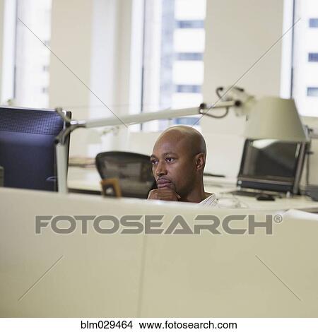 Picture - African American businessman working in office. Fotosearch