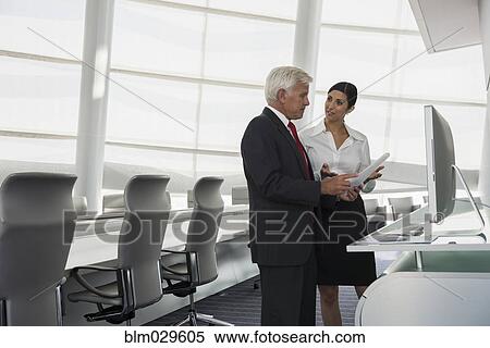 Business people talking in conference room View Large Photo Image Stock Photography - Business people talking in conference room. Fotosearch