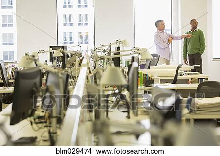 Businessmen talking in office View Large Photo Image Picture - Businessmen talking in office. Fotosearch