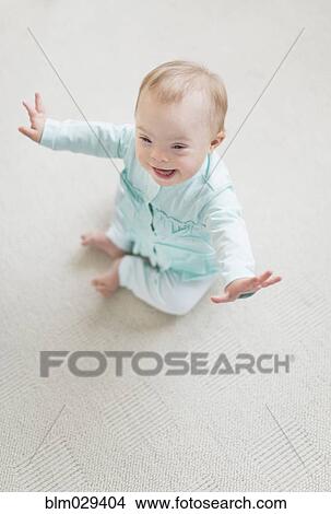 Caucasian baby girl with Down Syndrome laughing View Large Photo Image Picture - Caucasian baby girl with Down Syndrome laughing. Fotosearch