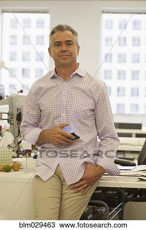 Caucasian businessman using cell phone in office View Large Photo Image Stock Image - Caucasian businessman using cell phone in office. Fotosearch