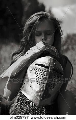 Caucasian girl carrying armor outdoors View Large Photo Image Stock Photo - Caucasian girl carrying armor outdoors. Fotosearch