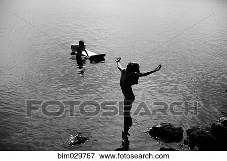 Caucasian girl leaning with head back in lake View Large Photo Image Stock Photo - Caucasian girl leaning with head back in lake. Fotosearch