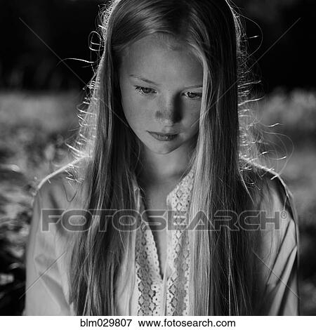 Caucasian girl looking down View Large Photo Image Stock Photo - Caucasian girl looking down. Fotosearch