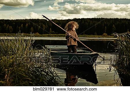 Caucasian girl rowing canoe in still lake View Large Photo Image Stock Image - Caucasian girl rowing canoe in still lake. Fotosearch