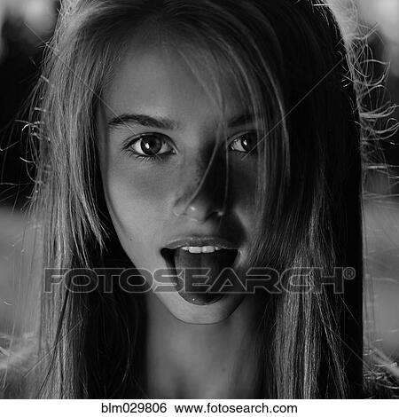 Caucasian girl sticking out her tongue View Large Photo Image Stock Photograph - Caucasian girl sticking out her tongue. Fotosearch