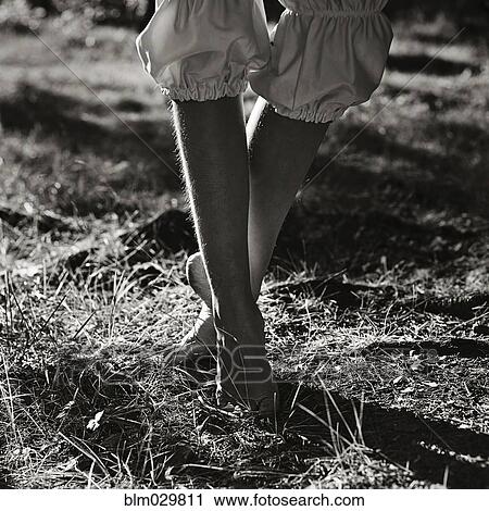 Stock Image - Caucasian girl walking outdoors. Fotosearch