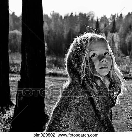 Caucasian girl wrapped in a blanket in forest View Large Photo Image Stock Image - Caucasian girl wrapped in a blanket in forest. Fotosearch