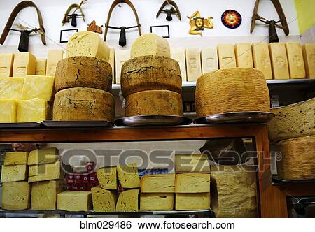 Cheeses for sale in shop View Large Photo Image Stock Photograph - Cheeses for sale in shop. Fotosearch