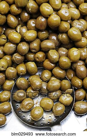 Stock Image - Close up of pile of olives. Fotosearch
