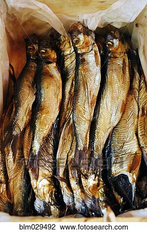 Stock Image - Close up of stack of fresh fish. Fotosearch