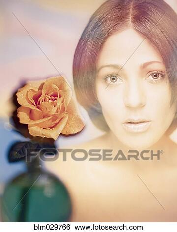 Stock Photograph - Digital composite of woman's face and rose. Fotosearch