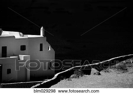 Dirt path and building overlooking coastline View Large Photo Image Stock Photo - Dirt path and building overlooking coastline. Fotosearch