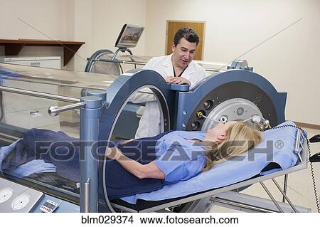 Doctor talking to patient in hyperbaric chamber View Large Photo Image Picture - Doctor talking to patient in hyperbaric chamber. Fotosearch
