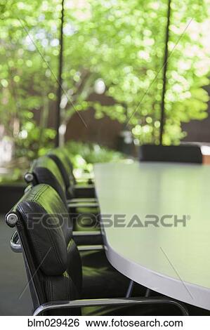 Stock Photograph - Empty chairs in meeting room. Fotosearch