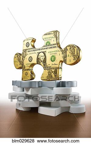 Gold piece of jigsaw puzzle printed with dollars View Large Photo Image Stock Photo - Gold piece of jigsaw puzzle printed with dollars. Fotosearch