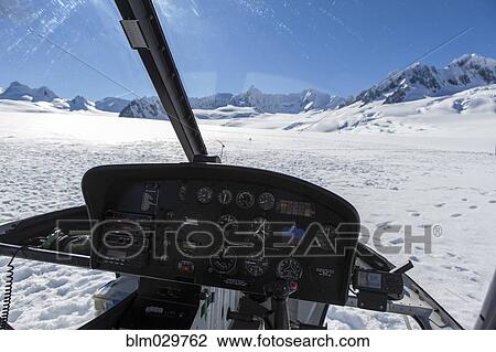 Stock Image - Helicopter landing on Fox Glacier, New Zealand. Fotosearch