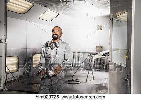 Hispanic mechanic working in auto shop View Large Photo Image Stock Photography - Hispanic mechanic working in auto shop. Fotosearch