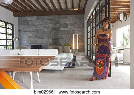 Hispanic woman smiling in living room View Large Photo Image Stock Image - Hispanic woman smiling in living room. Fotosearch