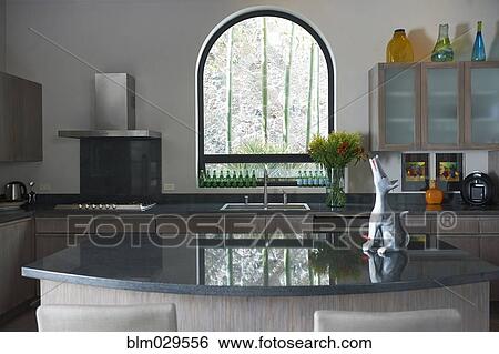 Howling dog decoration on kitchen island View Large Photo Image Stock Photograph - Howling dog decoration on kitchen island. Fotosearch