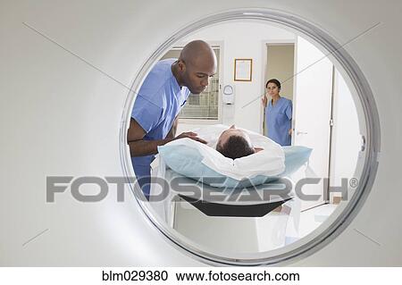 Nurses talking to patient before CAT scan View Large Photo Image Stock Image - Nurses talking to patient before CAT scan. Fotosearch
