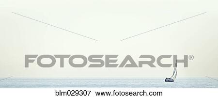 Sailboat in still water View Large Photo Image Stock Photo - Sailboat in still water. Fotosearch