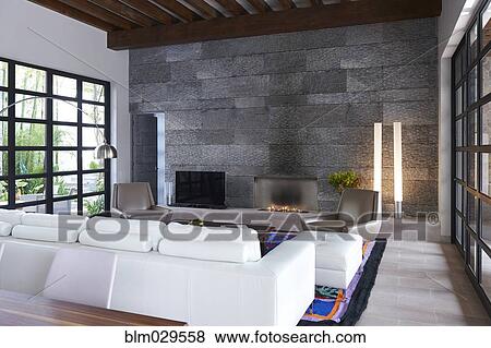 Sofa and stone wall in modern living room View Large Photo Image Stock Photo - Sofa and stone wall in modern living room. Fotosearch