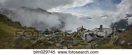 Stock Photography - Stone cottage near Mt Blanc trail, Bertone Refuge, Italy. Fotosearch