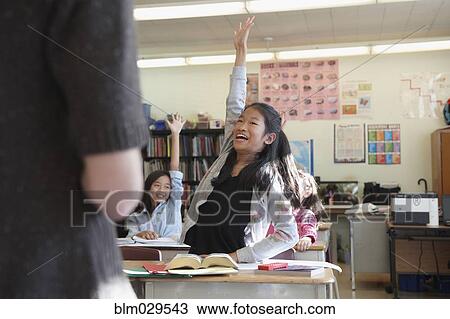 Student raising her hand in class View Large Photo Image Stock Image - Student raising her hand in class. Fotosearch